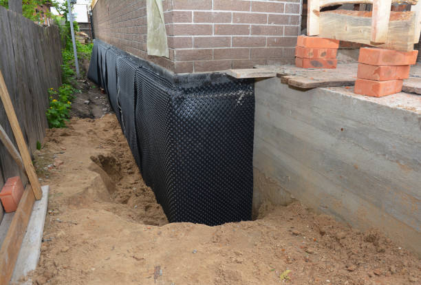 Happy homeowners after waterproofing job in Deal